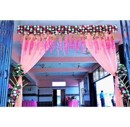 Stylish Wedding Gate With Drapes And Pink Flowers – Phule Weddings