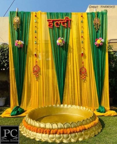 Haldi Decoration With Yellow Flowers And Marigold Backdrop – Phule Weddings