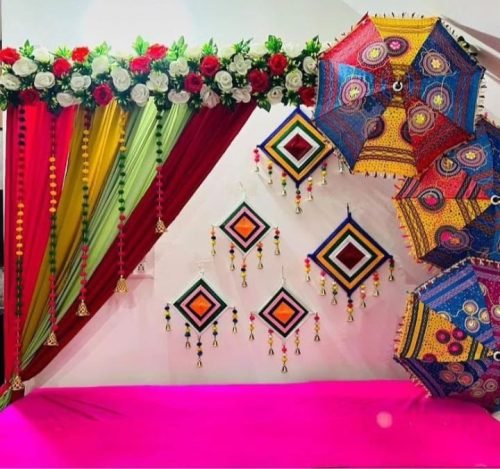 Indoor Mehndi Decoration With Drapes, Hanging Lanterns And Flowers | Phule Weddings