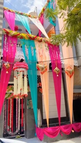 Home Decoration For Wedding With Marigold Flowers And Drapes | Phule Weddings